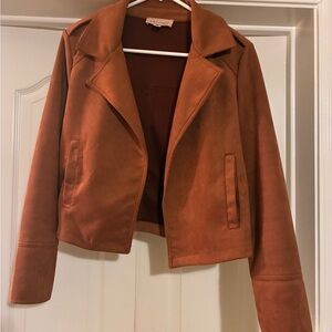 Rust faux leather Suede Women's Jacket 17” from shoulder to bottom of jacket.